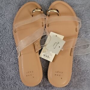 a new day Tan Slip-On Sandals with Clear Straps and Gold Accent
